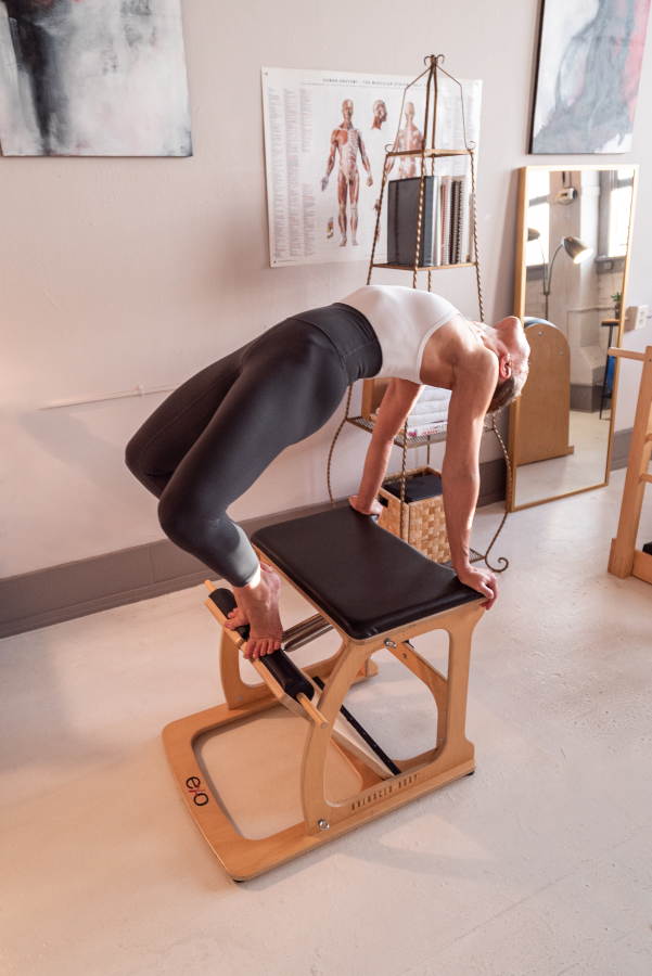 Pilates Instructor performing split back